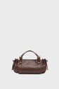 A brown cuir de vachette sac à main with gold hardware, short handles, and side drawstring details evokes the timeless appeal of an it-bag 24H, beautifully displayed against a plain light gray background.