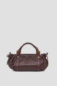 Dark brown sac à main en cuir with gold hardware, short handles, and gathered sides, displayed against a plain light gray background.
