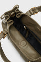 Olive green leather sac à main with tan stitching, gold hardware, and a magnetic snap closure. The bag is open, showing a black fabric-lined interior with a zippered pocket and features a bandoulière amovible for versatile carrying options.