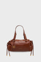 A brown cuir froissé leather handbag with two handles, gold hardware, drawstring sides, and a small tag. The bag boasts a smooth finish and BRUNO CAVALLI is printed in gold on the front, making this sac à main an elegant choice for everyday style.