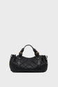 A black quilted leather handbag, or sac à main version matelassée, with gold hardware, two short handles, and drawstring details on the sides. The bag, showcasing a savoir-faire d’exception in its craftsmanship, is set against a plain light grey background.