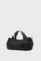 A black version matelassée sac à main in quilted leather with gold hardware, dual handles, and a drawstring detail on one side, beautifully showcasing a savoir-faire d’exception against a plain light background.