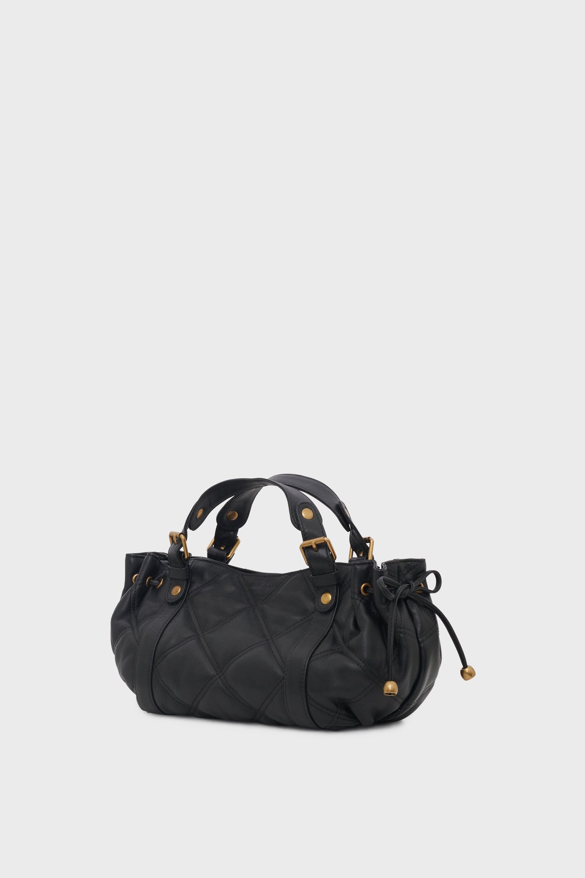 A black leather sac à main matelassé with a quilted pattern, short double handles, gold-tone hardware, and drawstring details on the sides, set against a plain light gray background. This it-bag 24H also features a bandoulière amovible for versatile carrying options.
