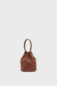 Brown leather bucket bag with a quilted pattern, gold hardware, and a single top handle, displayed against a plain light gray background—a stylish sac seau cuir that’s perfect for elevating your everyday look.