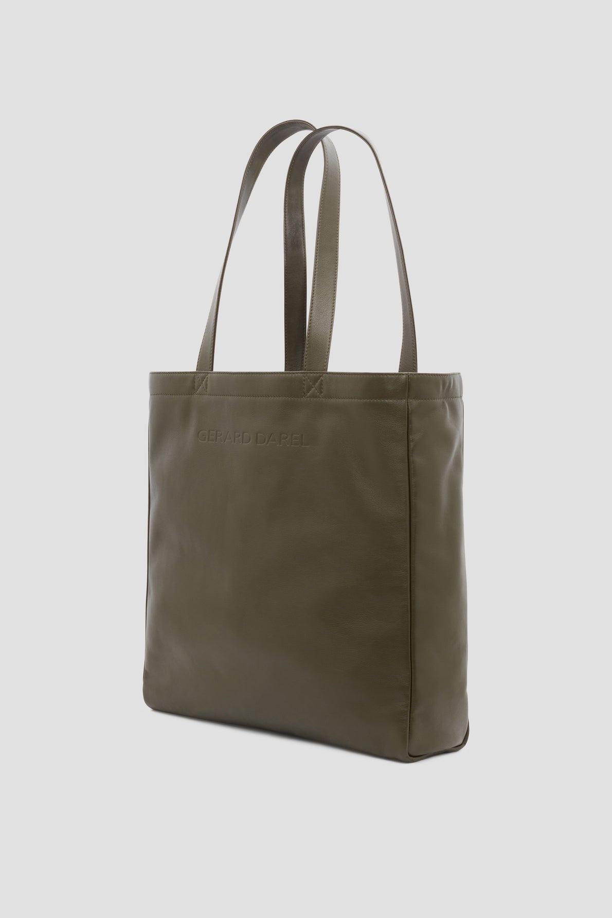 Olive green leather tote bag with two handles, a rectangular shape, and subtle embossed branding on the front. Reminiscent of the iconic cabas cuir Gérard Darel, this bag is set against a plain, light background.