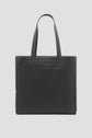 A black leather tote bag cuir with two handles and Gérard Darel embossed on the front, set against a plain light background—Merci Paris elegance in every detail.