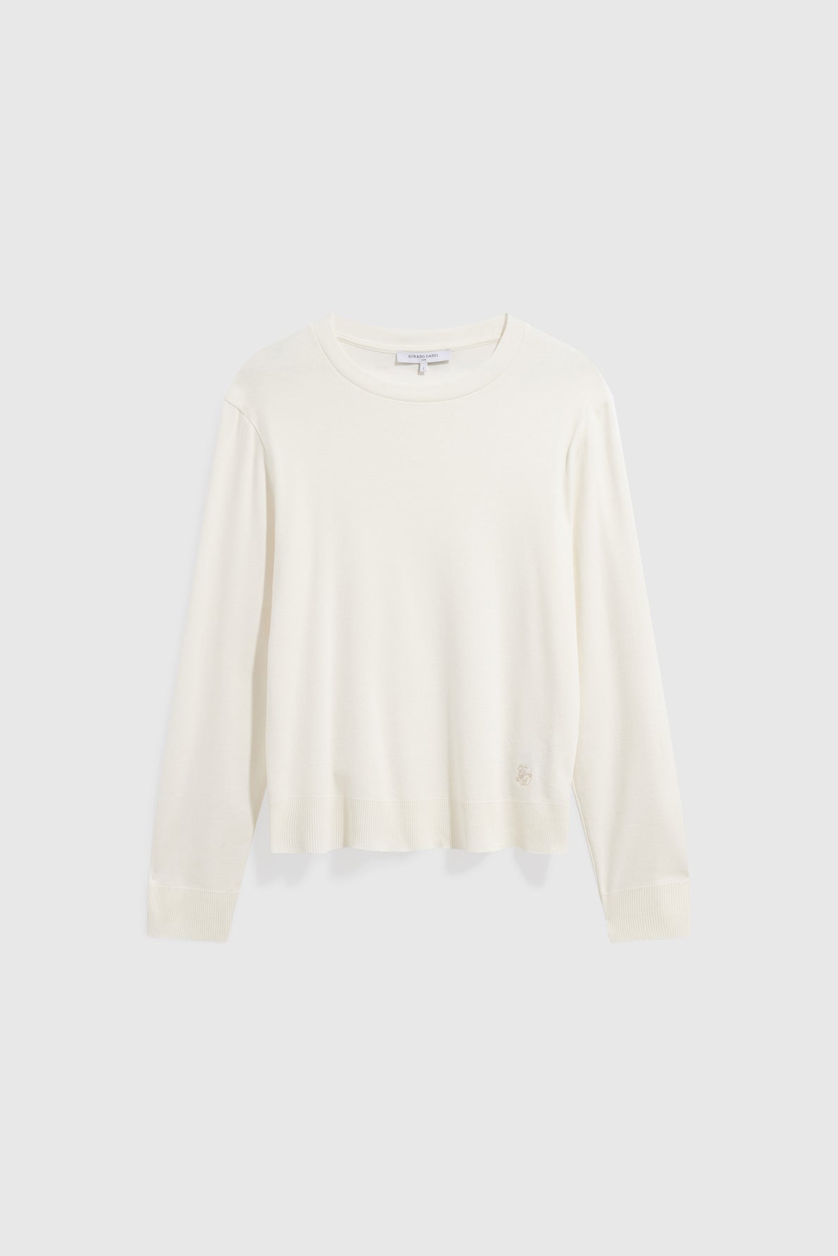 Long-sleeve, off-white crewneck sweater displayed on a plain light gray background. Crafted from coton épais, this sweater has a relaxed fit with ribbed cuffs and hem, reminiscent of the effortless comfort of a tee-shirt Bara à manches longues.