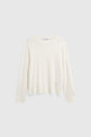 Long-sleeve, off-white crewneck sweater displayed on a plain light gray background. Crafted from coton épais, this sweater has a relaxed fit with ribbed cuffs and hem, reminiscent of the effortless comfort of a tee-shirt Bara à manches longues.