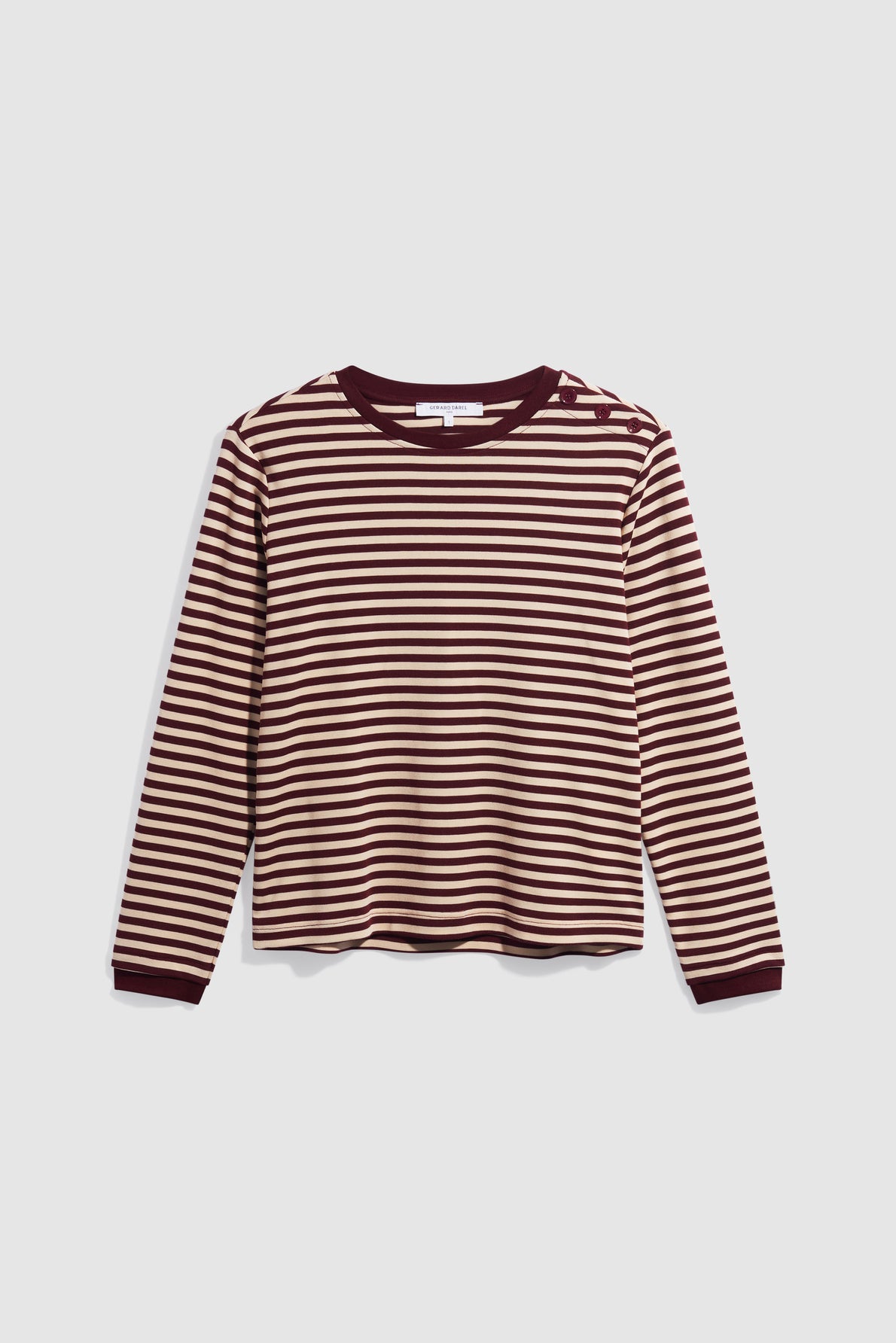 A long-sleeve tee-shirt à rayures with horizontal maroon and beige stripes, displayed flat on a plain light background. The shirt features a col rond and offers a relaxed fit.