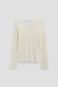 A long-sleeve, cream-colored ribbed top crafted from mailles côtelé, featuring a round neckline and subtle scalloped edges on the cuffs and hem, displayed on a plain light background.