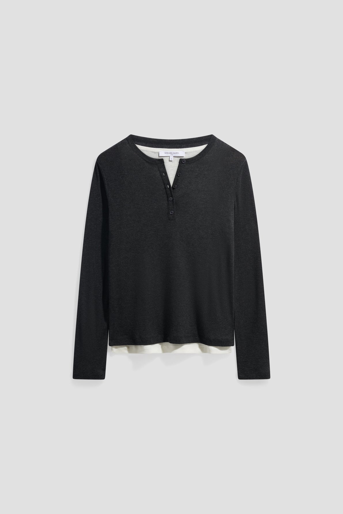 A black long-sleeve Henley shirt with three buttons at the collar, crafted from maille fine, displayed on a plain light background.