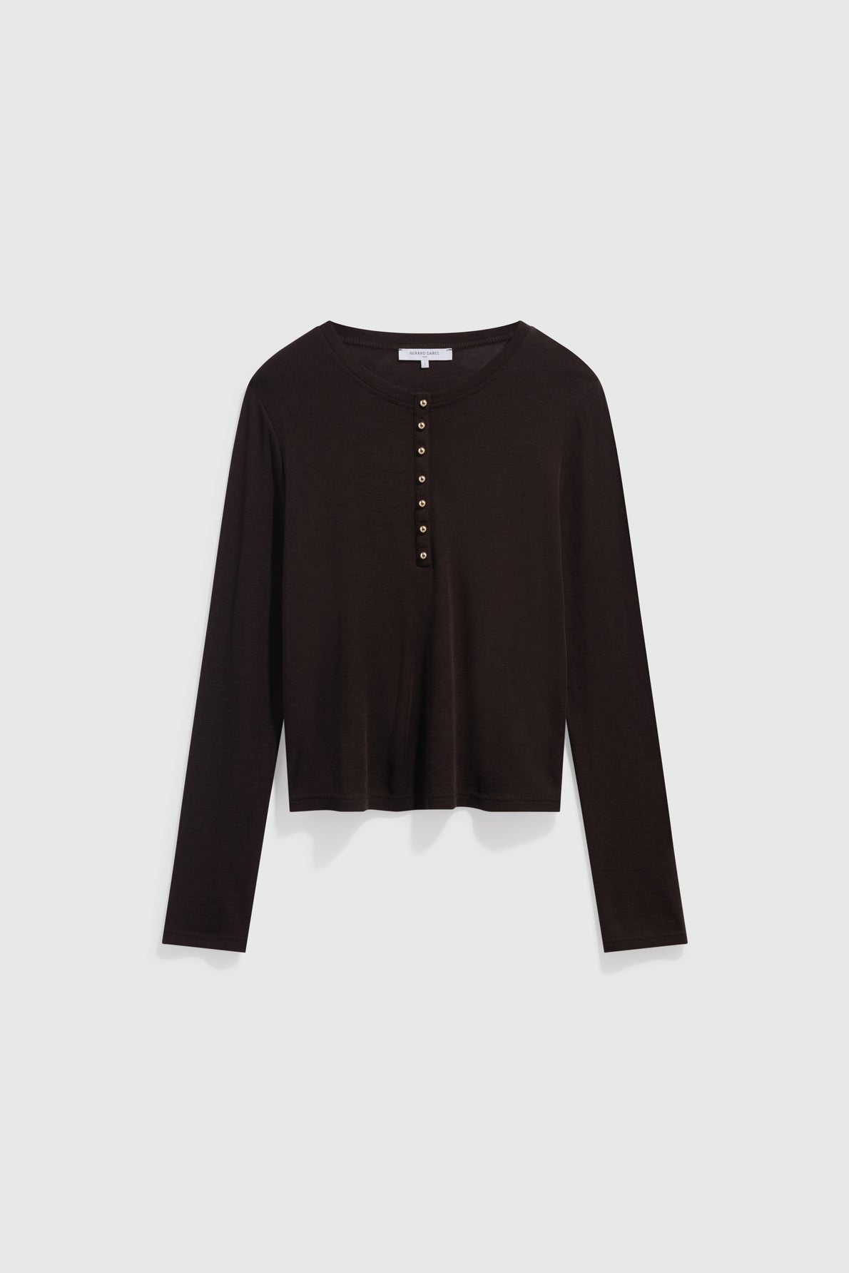 A black long-sleeve, cropped t-shirt chic with a round neckline and five buttons down the front, displayed on a plain white background.