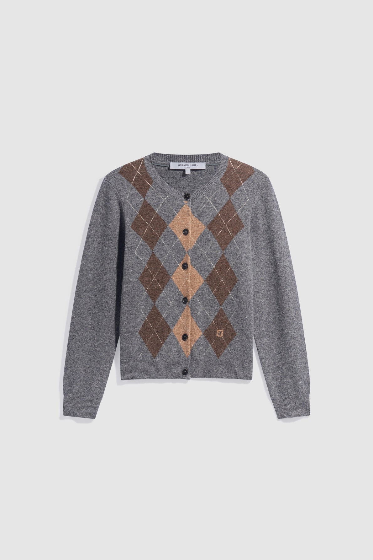 Gray gilet gris cardigan with long sleeves, black buttons, and a brown, tan, and dark gray motif losanges argyle pattern on the front. The background is plain white.