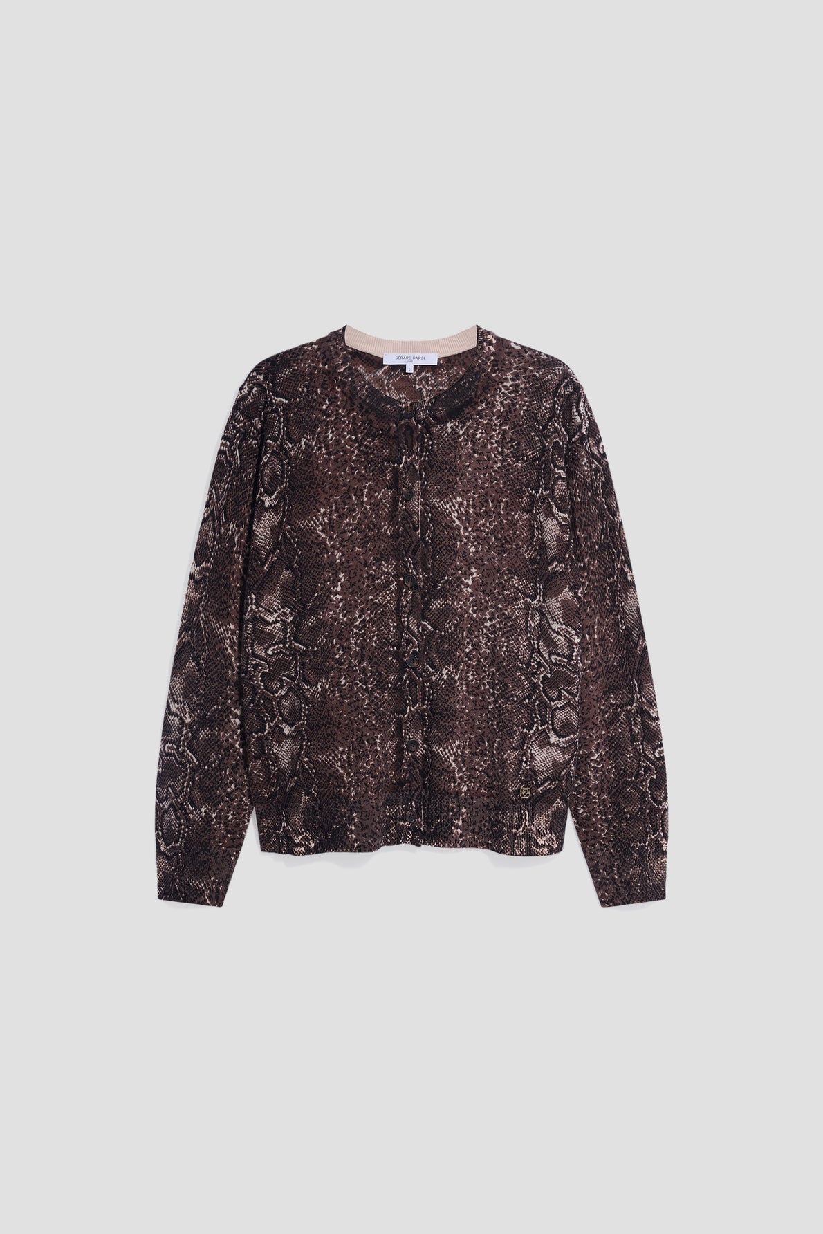 Long-sleeved button-up shirt with an imprimé python, laid flat on a light gray background.