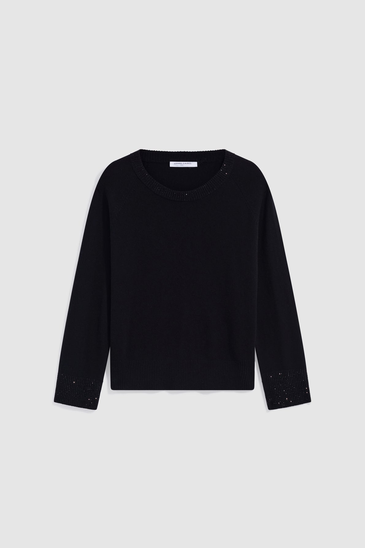 A black long-sleeve sweater in soft laine with a round neckline, ribbed cuffs, and a ribbed hem, displayed on a plain light gray background—this pull noir offers timeless comfort and effortless style.