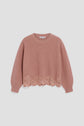 A mauve knit sweater with a round neckline and long sleeves, this elegant pull dentelle features a scalloped lace trim along the hem for a touch of feminine charm.