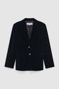 Navy blue velvet blazer with notched lapels, two front pockets, a chest pocket, two metallic buttons, and long sleeves—a perfect veste tailleur velours for a sophisticated winter look—displayed on a plain light gray background.