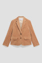Tan corduroy blazer with two buttons, a notched lapel, one chest pocket, and two front flap pockets, laid flat on a white background—this veste tailleur velours is the perfect blend of chic and décontractée style for any occasion.