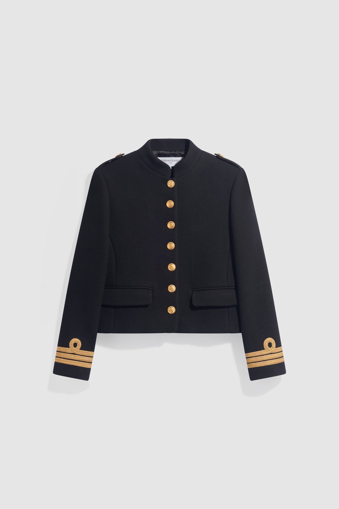 A black military-style jacket with gold buttons, epaulets on the shoulders, two front pockets, and gold trim with circular emblems on the cuffs, reminiscent of a classique veste militaire. This chic veste courte femme is displayed against a plain light background.