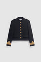 A black military-style jacket with gold buttons, epaulets on the shoulders, two front pockets, and gold trim with circular emblems on the cuffs, reminiscent of a classique veste militaire. This chic veste courte femme is displayed against a plain light background.