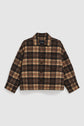 A brown and beige plaid surchemise en laine with a collar and long sleeves, displayed on a plain white background.