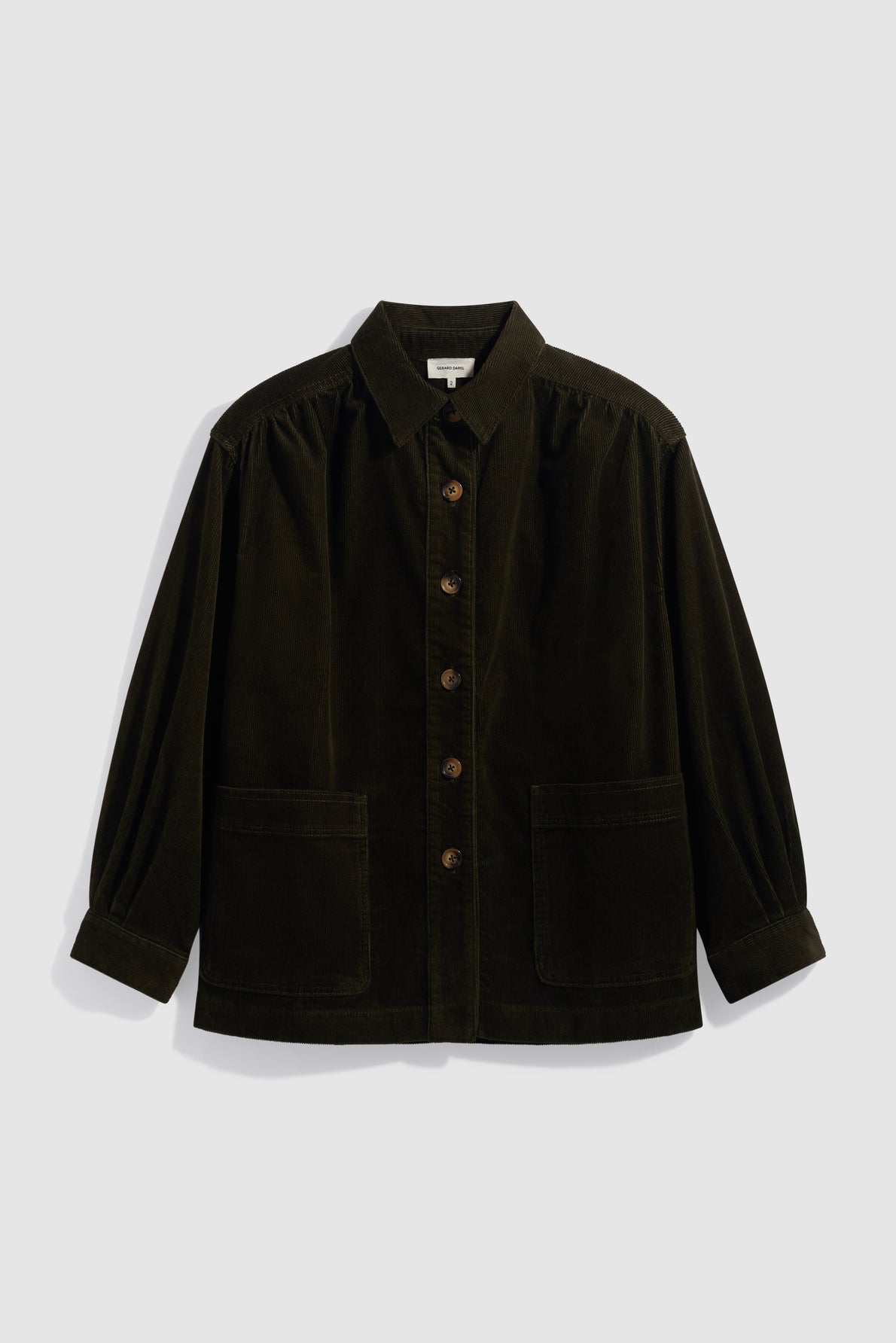 A dark brown surchemise velours côtelé button-up jacket with long sleeves, grandes poches on the front, and a collar, displayed against a plain light background.