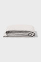 A neatly folded light gray bedsheet is displayed against a plain white background.