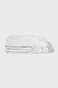 A neatly folded white fitted bed sheet with visible elastic edges, placed on a plain light grey background.