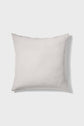 A square, light beige pillow with a subtle texture is shown against a plain white background.