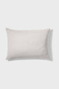 A plain white rectangular pillow with a slightly textured fabric, placed on a light gray background.