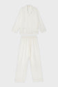 A matching white pajama set with a long-sleeve button-up top and elastic waist pants, both made from a lightweight, textured fabric, displayed on a plain background.