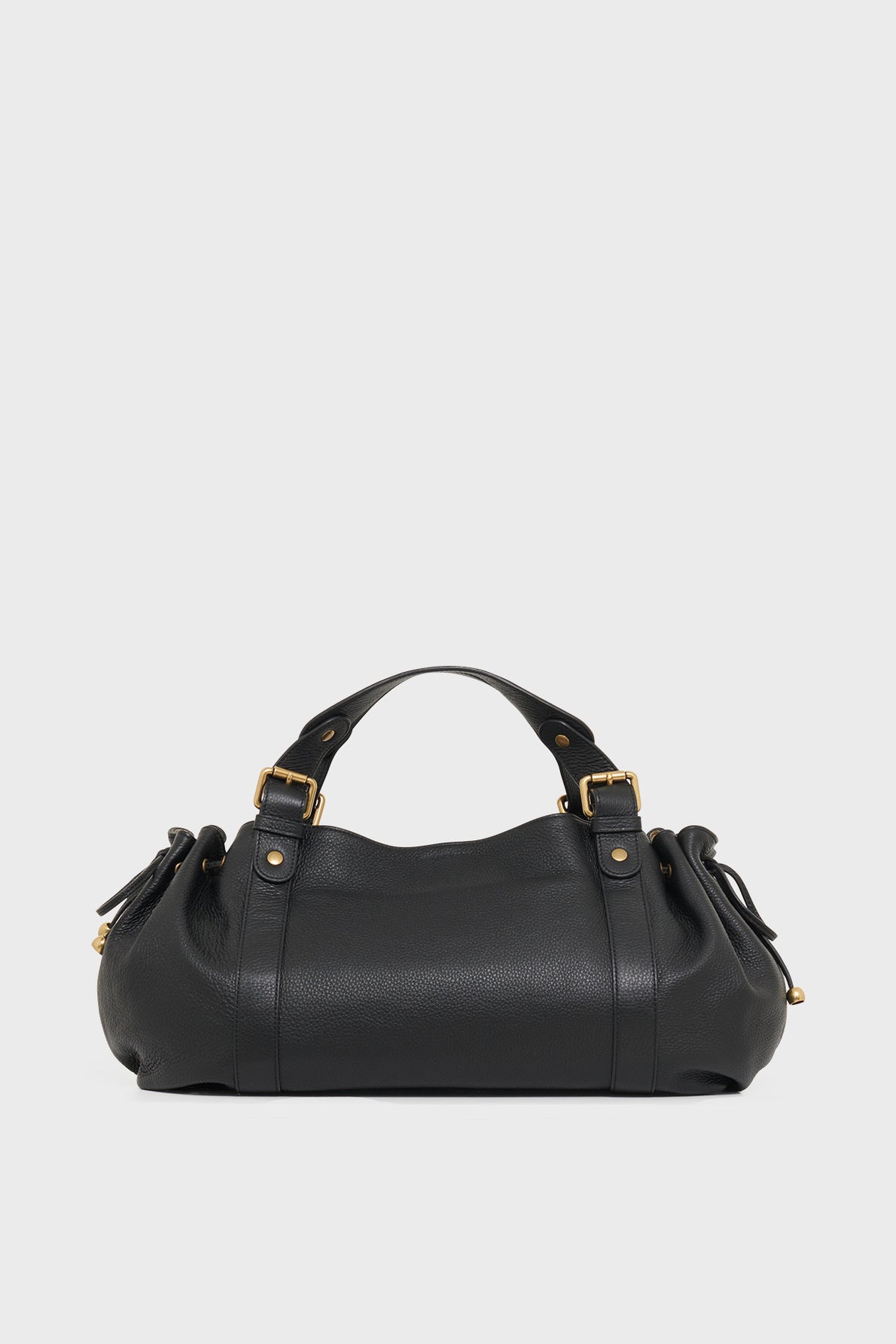 A black leather sac à main with gold-tone hardware, two short handles, and a rounded, slightly slouchy shape, displayed against a plain white background.
