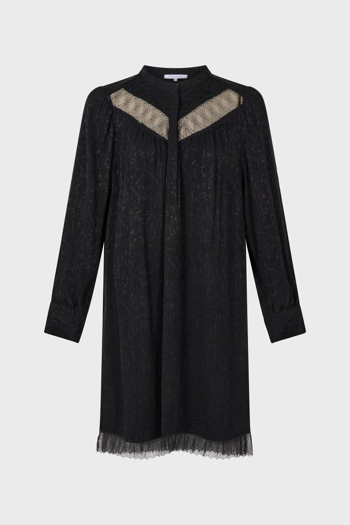 A long-sleeve black robe courte jacquard with sheer dentelle bohème chic details at the neckline and hem, featuring a subtle pattern and a relaxed, knee-length silhouette.