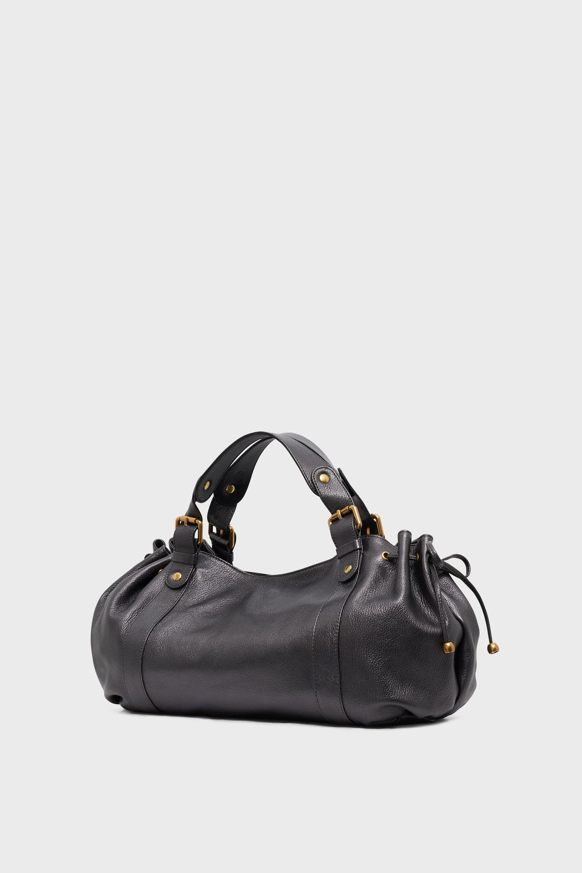 A black cuir de chèvre leather sac à main with gold-tone hardware, two short handles, and gathered drawstring sides, displayed against a plain light gray background.