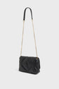 Black quilted leather shoulder bag crafted from luxurious sac cuir d’agneau, featuring a gold chain strap and black leather shoulder pad, displayed against a plain white background—a timeless sac bandoulière femme from Gerard Darel.