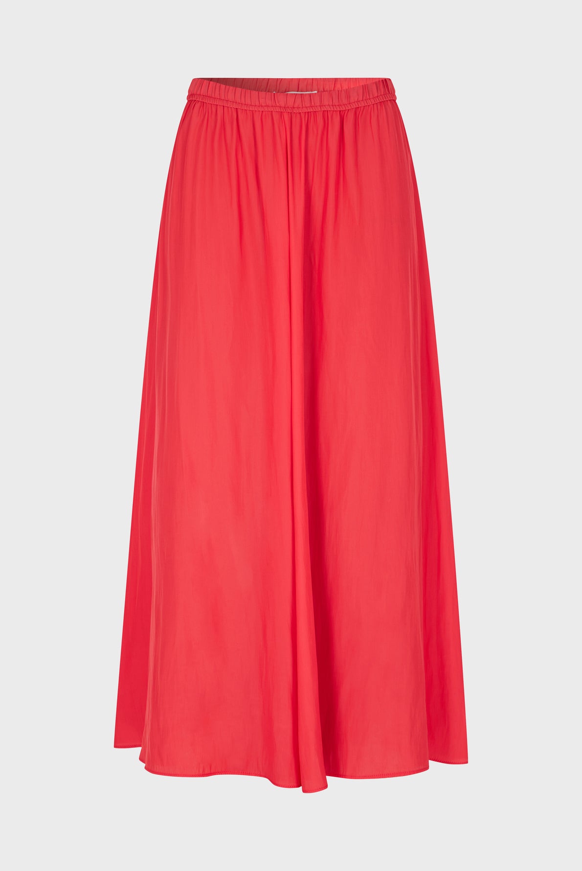 A bright red, knee-length jupe plissée in an A-line silhouette with an elastic waistband, displayed on a plain white background.