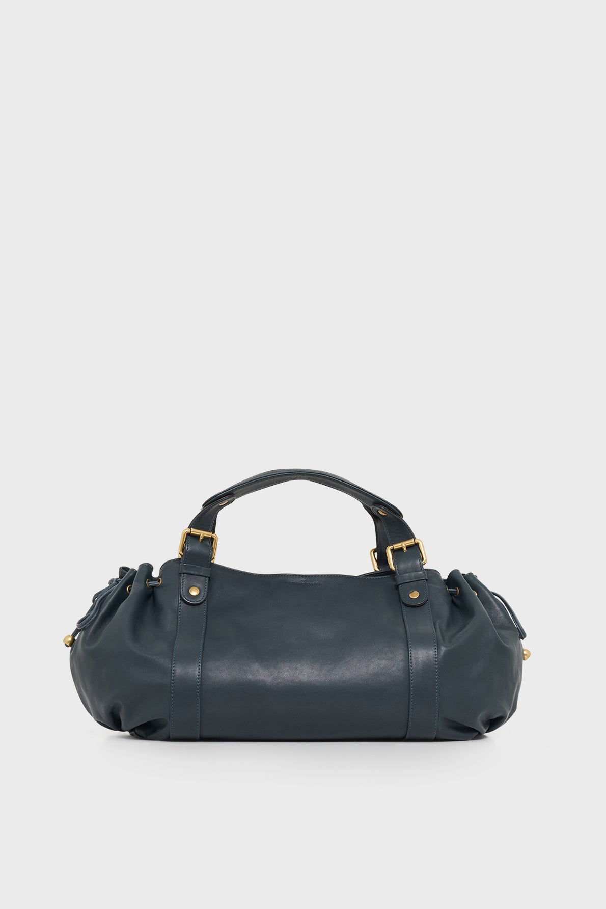 A dark blue cuir délicat leather sac à main in a satchel style, featuring gold hardware, dual handles, and gathered detailing at the sides—an elegant piece of maroquinerie Darel displayed against a plain light background.