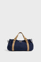 A navy blue GD Canvas duffel bag with tan leather handles and straps, displayed against a plain light gray background.