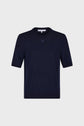 Navy blue short-sleeve knit sweater with a crew neck, subtle textured finish, and a small embroidered emblem on the chest, displayed against a plain light gray background.