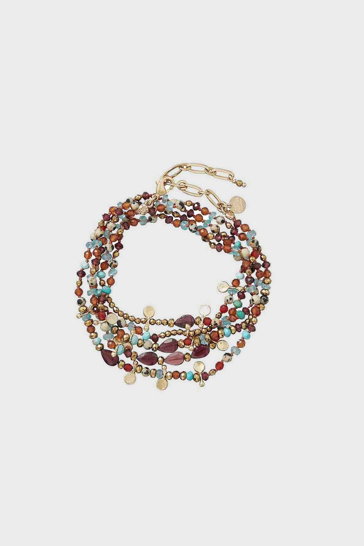 A multi-strand bracelet with small colorful beads in red, turquoise, gold, and brown tones—reminiscent of refined pierre turquoise jewelry—featuring gold disc charms and an adjustable gold clasp.