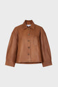 Brown leather veste courte cuir with a collar, front buttons, a single chest pocket, and wide sleeves, displayed on a plain white background.